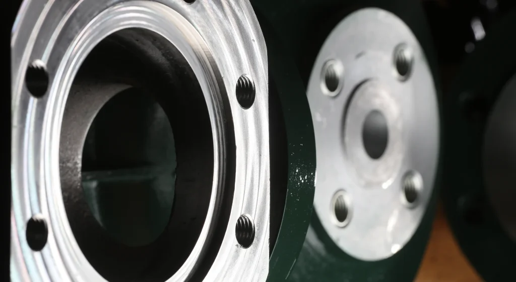 Machined flange faces on a painted valve body