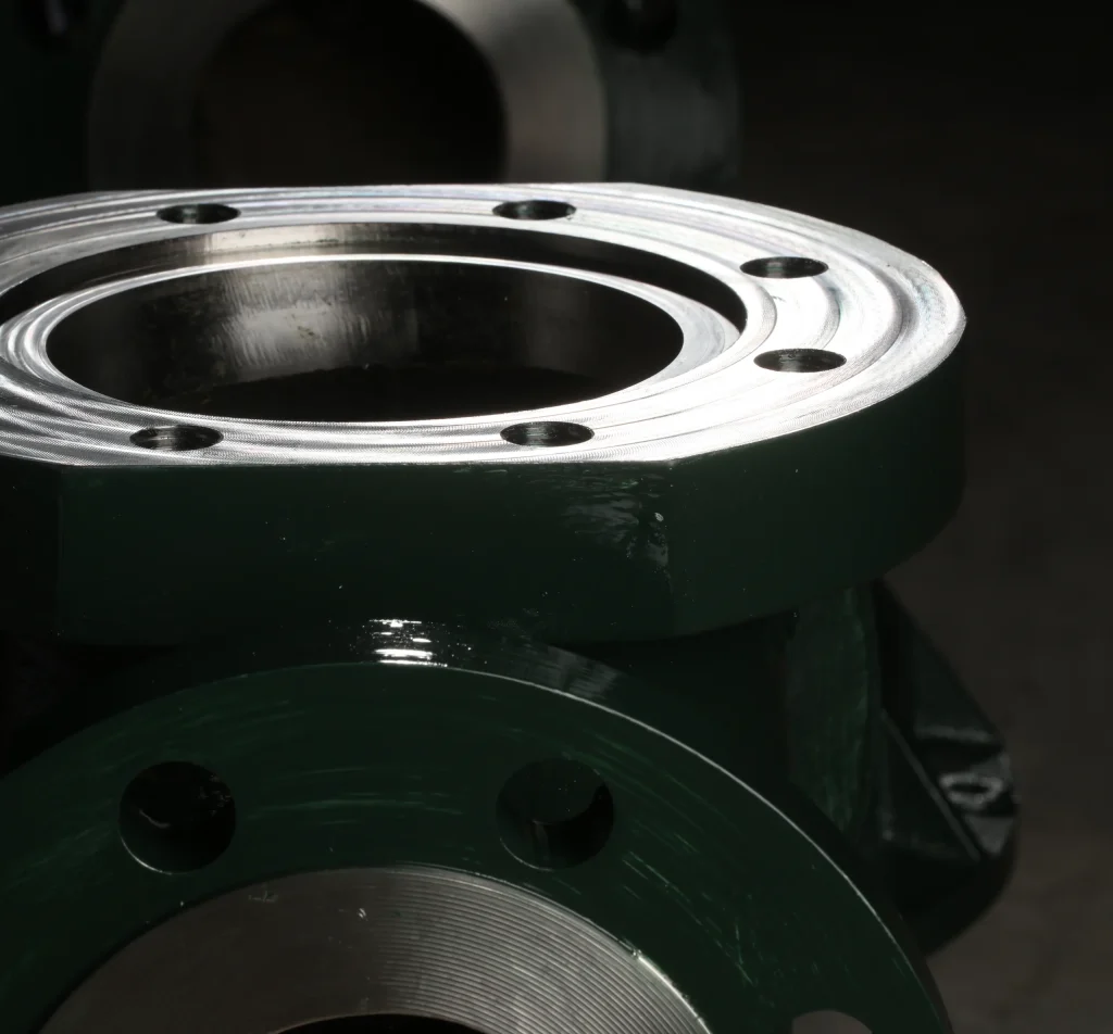 Machined flange on a dark painted valve body